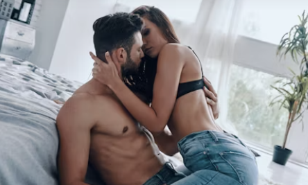 Couple embracing intimately in bedroom